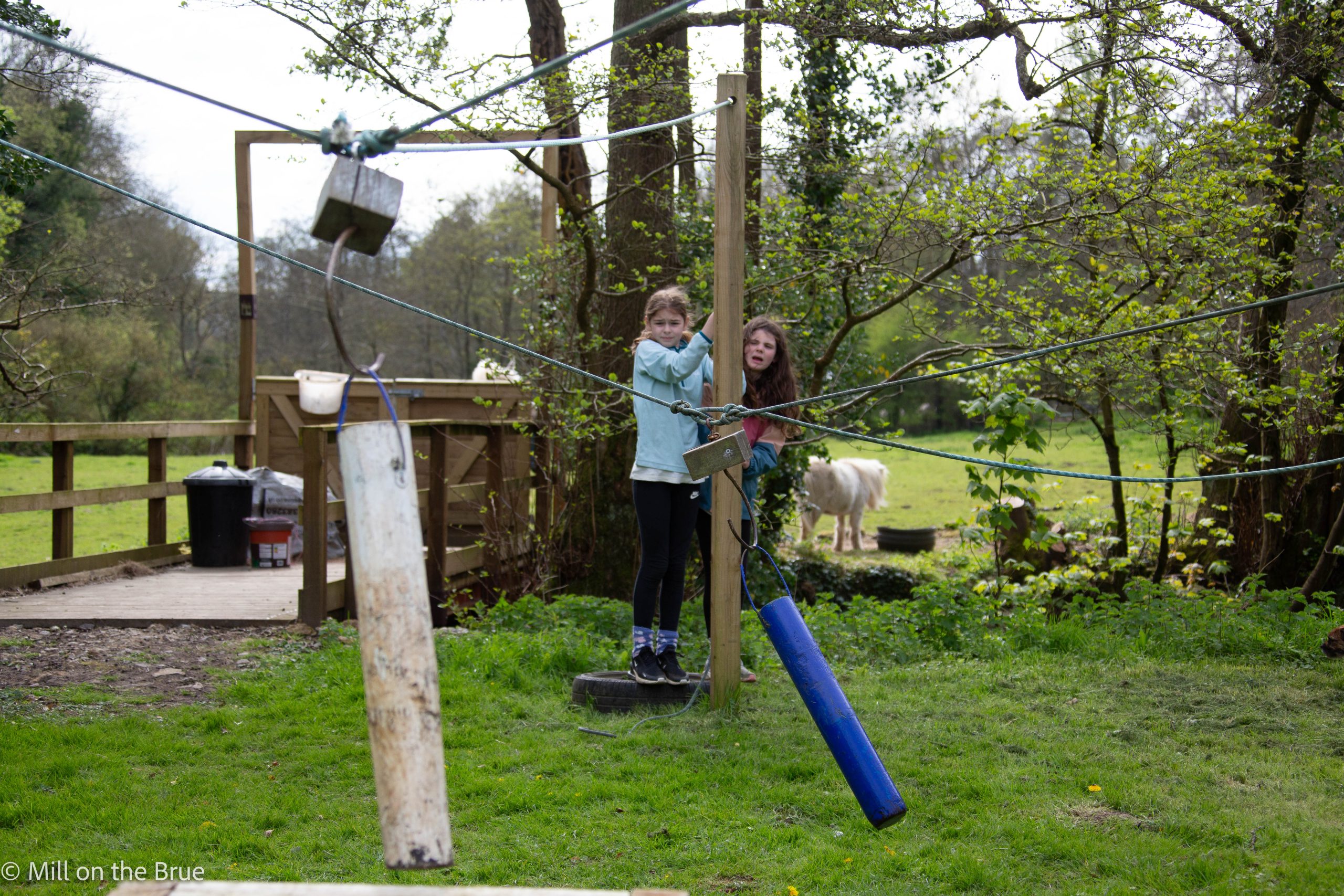 Students playing a game with pulleys.