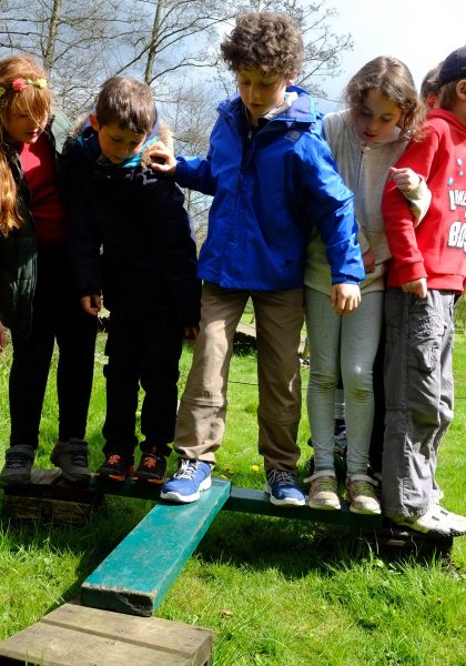 Children on a balance beam.