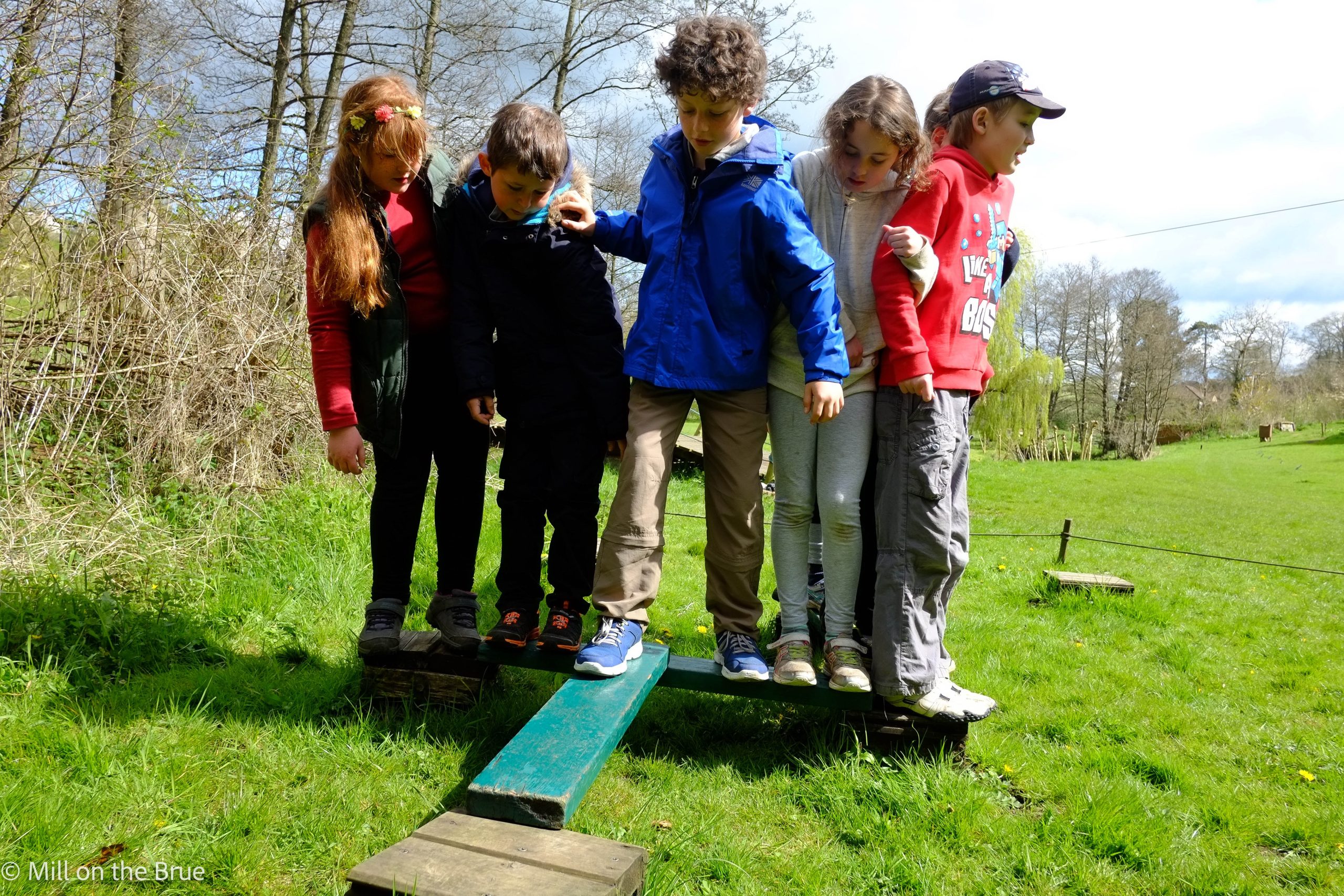 Children on a balance beam.