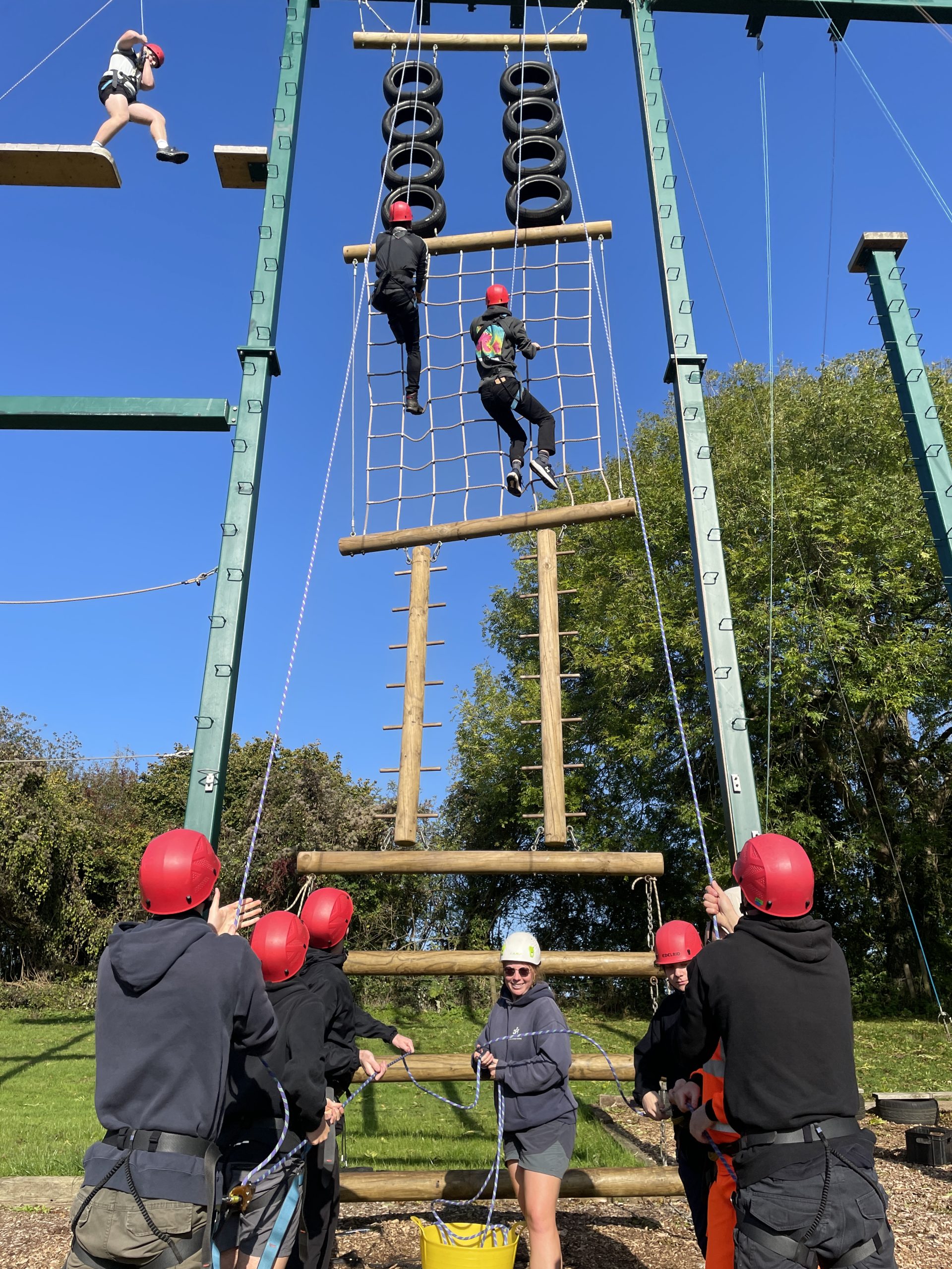 Visitors climb the gladiator wall.
